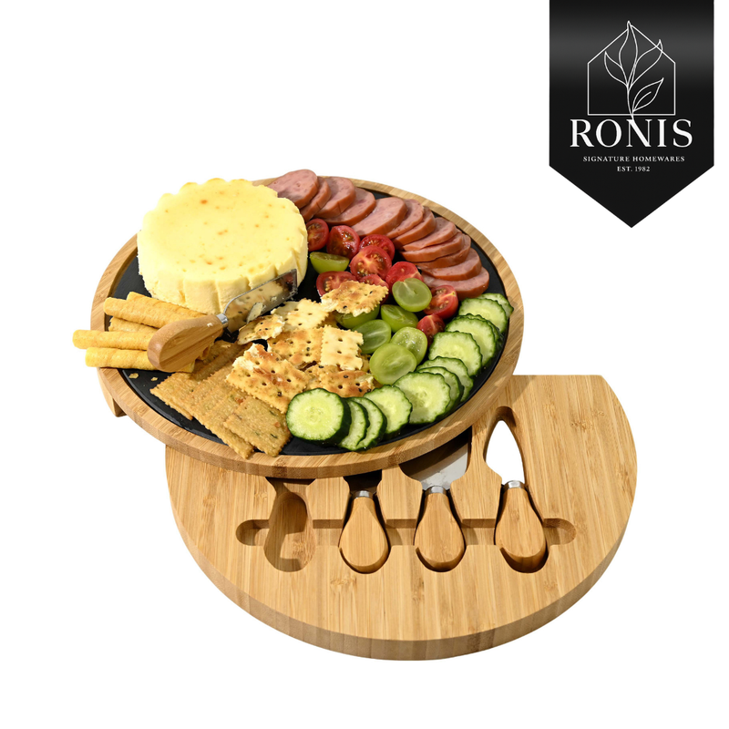 Wooden charcuterie board with assorted meats, cheeses, and vegetables on a white background, featuring the Ronis Signature Homewares