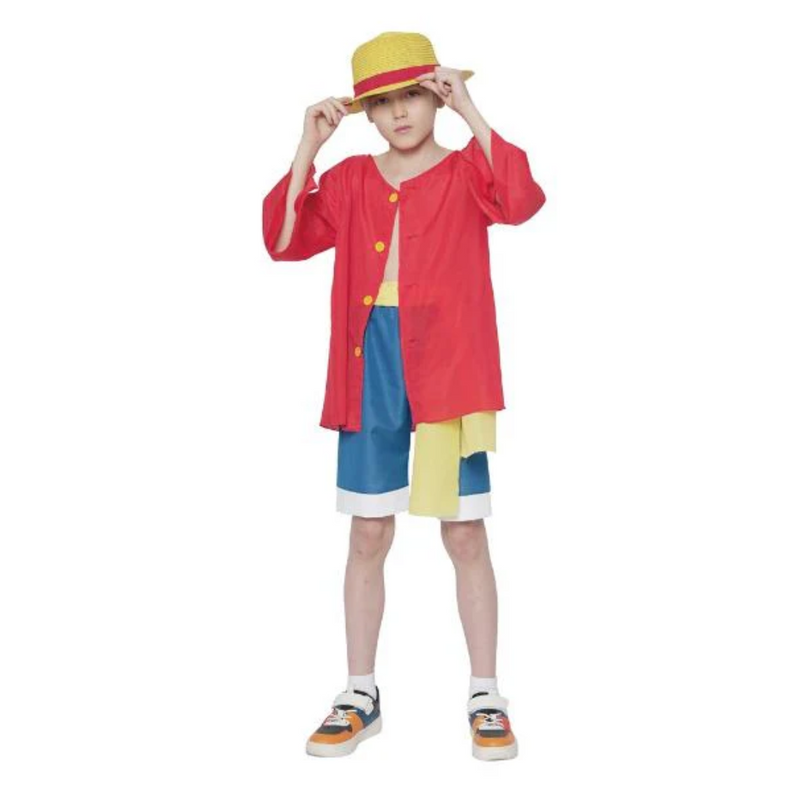Child wearing a colorful outfit with a red jacket, blue shorts, and yellow hat 