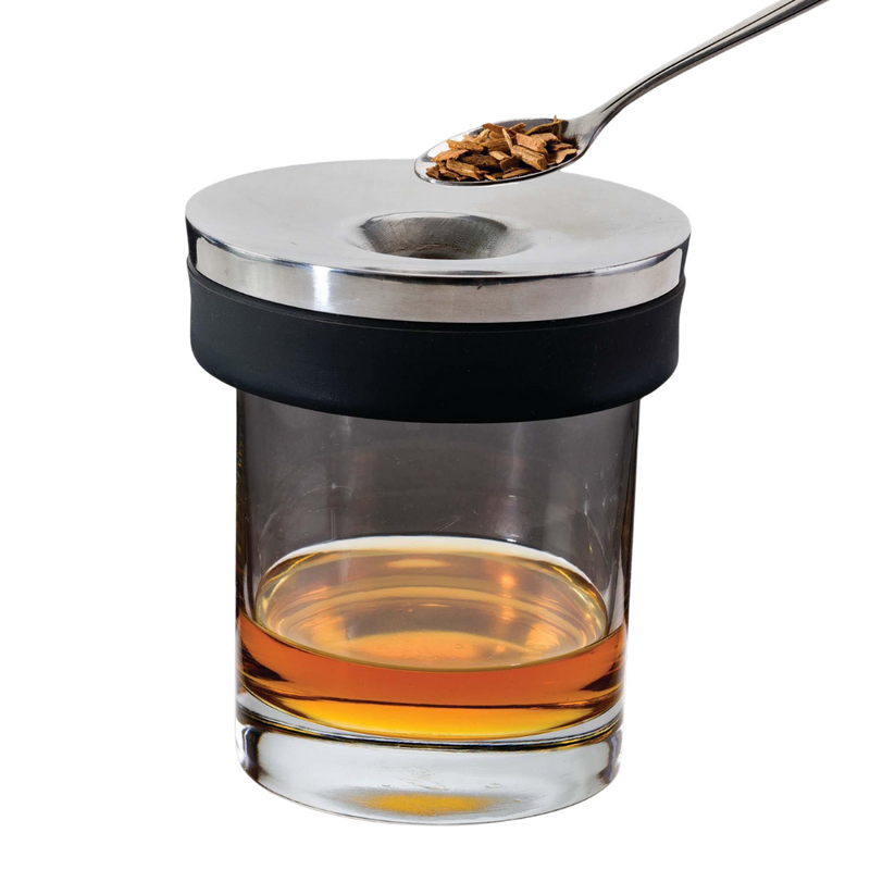 Joie Cocktail Smoker with smoking chamber and wood chips, designed to infuse drinks with rich, smoky flavor.