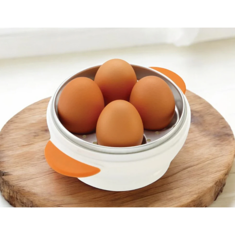 Eggs in a white container with orange accents on a wooden surface