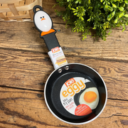 Mini frying pan with handle on a wooden surface – thumbnail