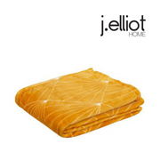 Celeste throw blanket 130x160cm in mustard colour on sofa – thumbnail