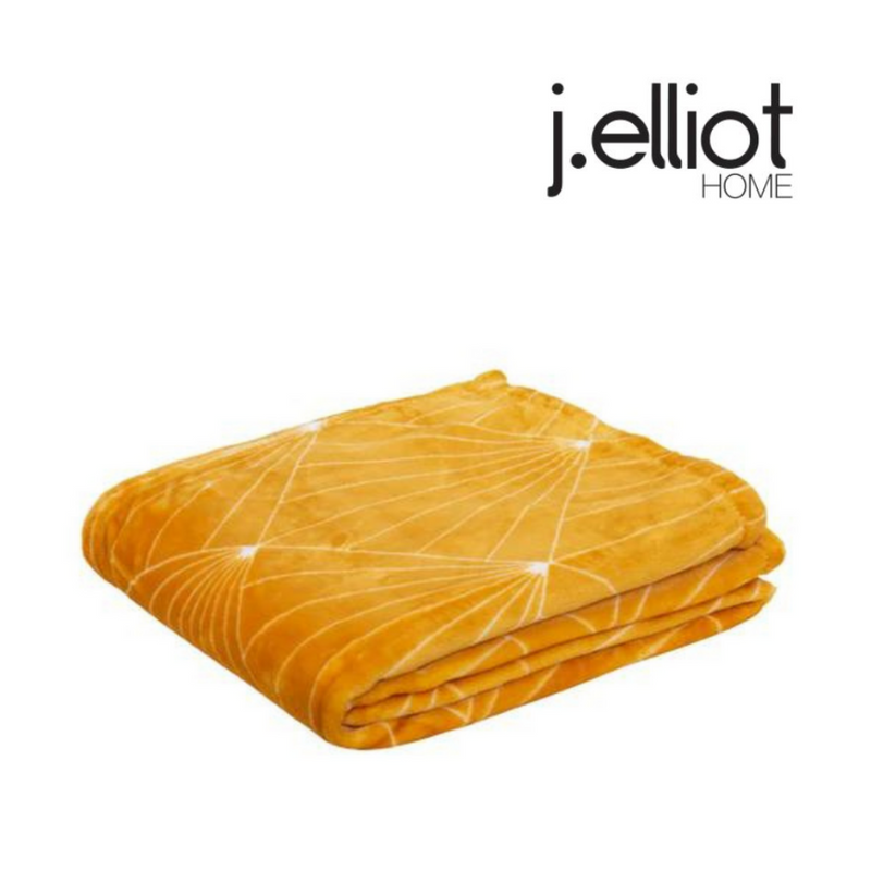 Celeste throw blanket 130x160cm in mustard colour on sofa