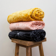 Celeste throw blanket 130x160cm in mustard colour on sofa – thumbnail